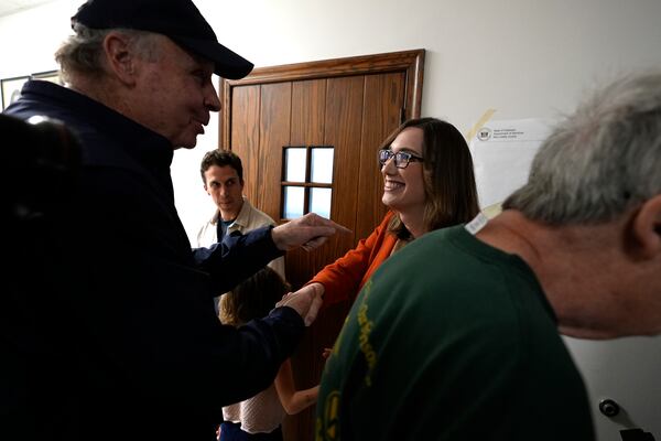 FILE - Sarah McBride, Democratic candidate for Delaware's at-large congressional district, greets people at the Immanuel Highlands Episcopal Church on Election Day, Tuesday, Nov. 5, 2024, in Wilmington, Del. She became the first openly transgender person elected to Congress. (AP Photo/Pamela Smith, File)