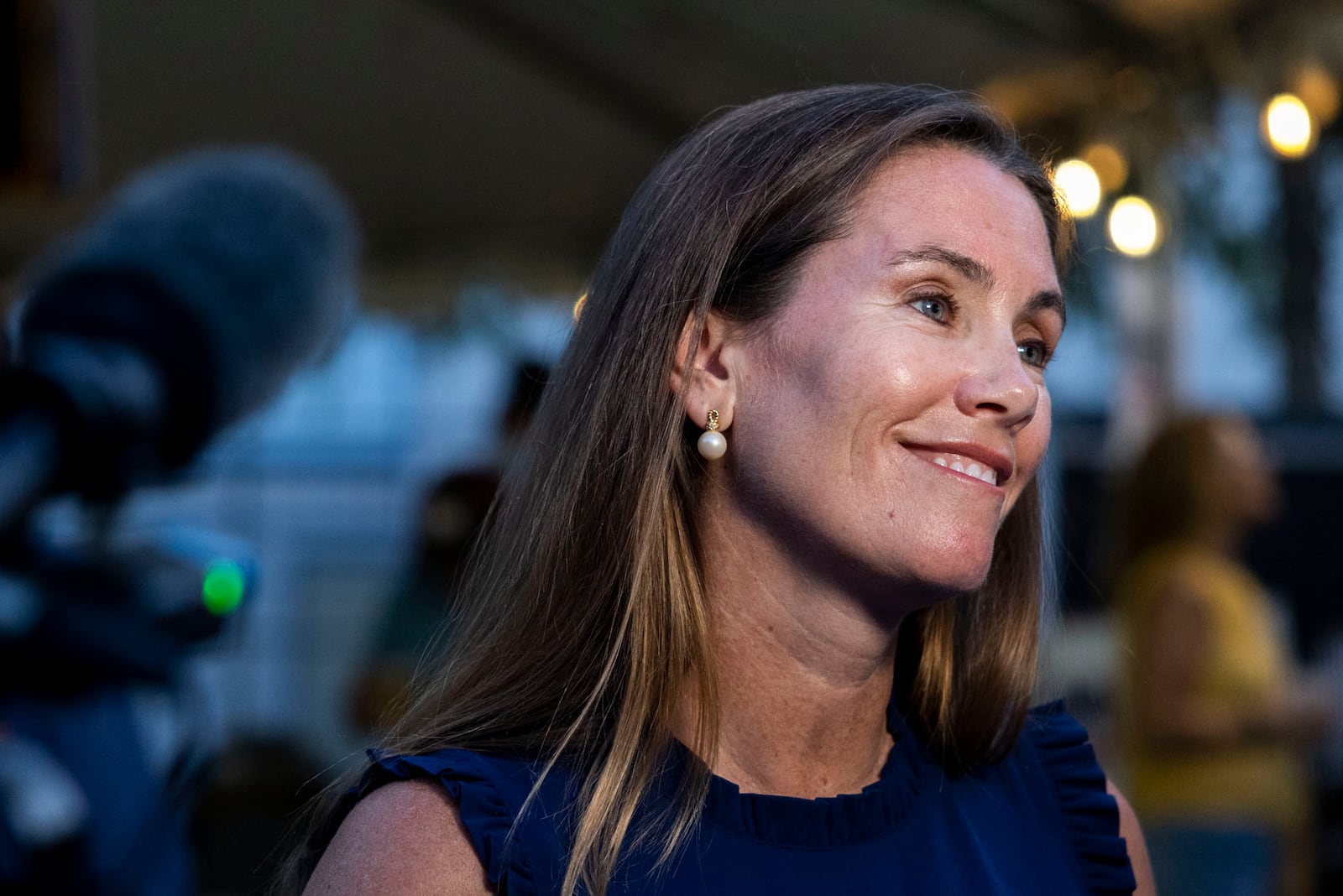 Missy Cotter Smasal speaks to members of the media at Ballyhoos in Virginia Beach, Va., after winning the Democratic nomination in the race to represent the 2nd Congressional District in the U.S. House of Representatives, June 18, 2024. (Kendall Warner/The Virginian-Pilot via AP)