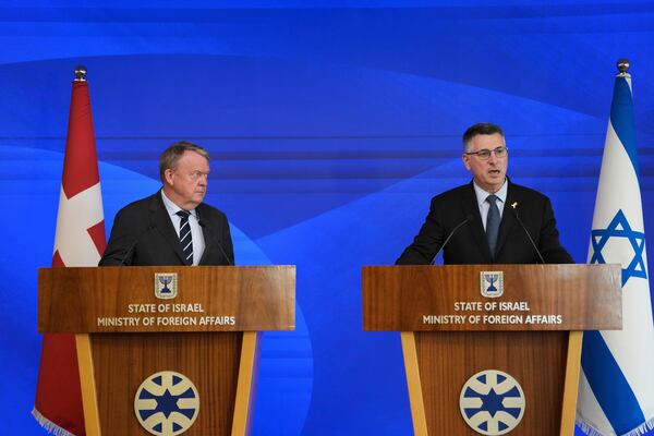 Israeli Foreign Minister Gideon Saar, right, and his Danish counterpart, Lars Lokke Rasmussen, speak to the media in Jerusalem on Monday, Jan 13, 2025. (AP Photo/Ohad Zwigenberg)