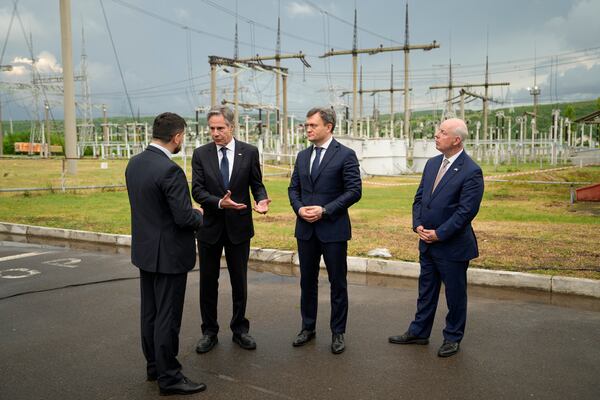 FILE - United States Secretary of State Antony Blinken, second left, talks with acting director of Moldelectrica, Sergiu Aparatu, left, Moldova's Prime Minister Dorin Recean, center, and US Ambassador to Moldova Kent Doyle Logsdon during a visit to the site of Moldelectrica Chisinau Substation in Braila south of the capital of Moldova, Wednesday, May 29, 2024. (AP Photo/Vadim Ghirda, File)