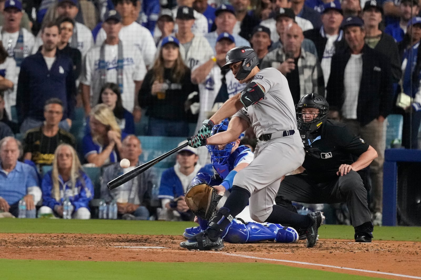 New York Yankees' Giancarlo Stanton connects for a two-run home during the sixth inning in Game 1 of the baseball World Series against the Los Angeles Dodgers, Friday, Oct. 25, 2024, in Los Angeles. (AP Photo/Mark J. Terrill)