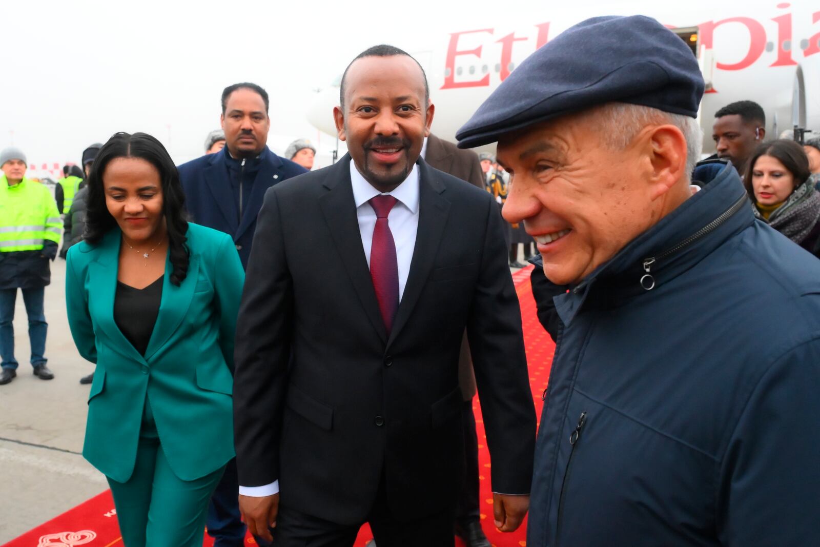 Ethiopian Prime Minister Abiy Ahmed, center, is greeted by the Head of Republic of Tatarstan Rustam Minnikhanov, right, upon his arrival at Kazan International Airport prior to the BRICS summit in Kazan, Russia, Tuesday, Oct. 22, 2024. (Ilya Pitalev/Photo host brics-russia2024.ru via AP)