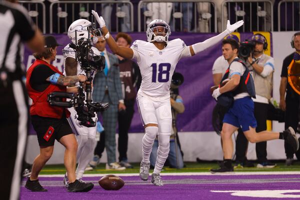 Minnesota Vikings wide receiver Justin Jefferson (18) celebrates after catching a 7-yard touchdown pass during the first half of an NFL football game against the Chicago Bears, Monday, Dec. 16, 2024, in Minneapolis. (AP Photo/Bruce Kluckhohn)