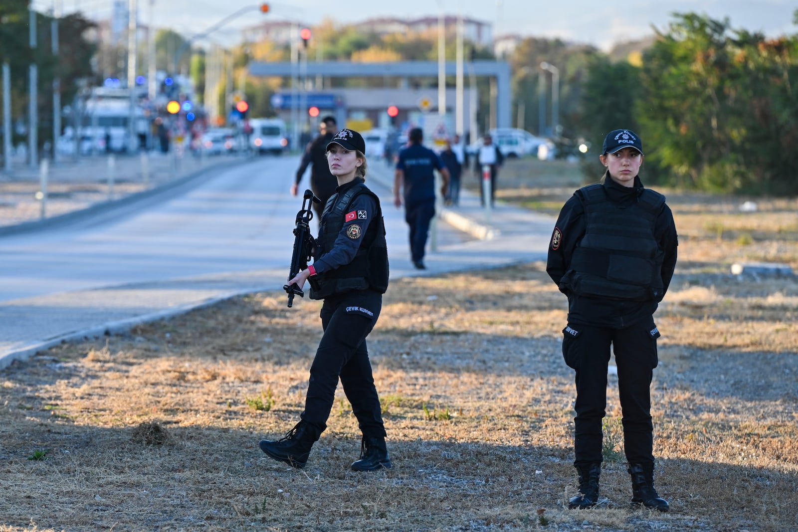 Emergency and security teams are deployed outside of Turkish Aerospace Industries Inc. at the outskirts of Ankara, Turkey, Wednesday, Oct. 23, 2024. (AP Photo/Mert Gokhan Koc)