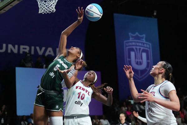 Vinyl's Rhyne Howard (10) defends against Rose's Angel Reese (5) during the first half of an Unrivaled 3-on-3 basketball game Friday, Jan. 17, 2025, in Medley, Fla. (AP Photo/Marta Lavandier)