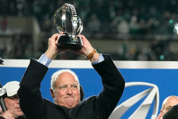 Philadelphia Eagles owner Jeffrey Lurie celebrates with the trophy after their win against the Washington Commanders in the NFC Championship NFL football game, Sunday, Jan. 26, 2025, in Philadelphia. (AP Photo/Seth Wenig)