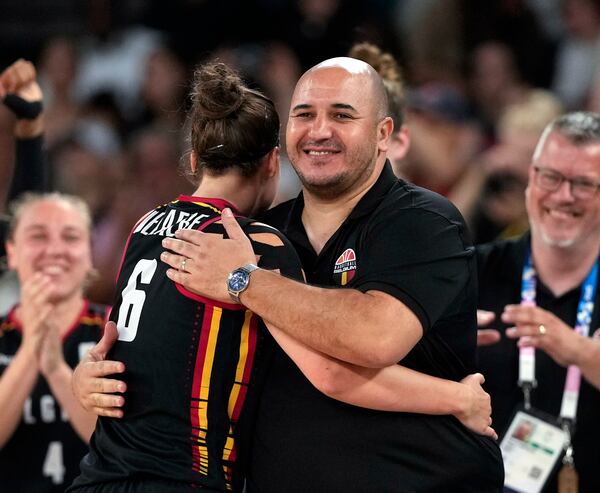 FILE - Belgium head coach Rachid Meziane, center right, hugs Antonia Delaere (6) during a women's quarterfinal game against Spain at Bercy Arena at the 2024 Summer Olympics, Aug. 7, 2024, in Paris, France. (AP Photo/Mark J. Terrill, File)