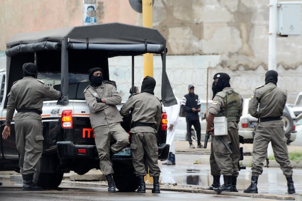 Mozambique's Special forces members deployed to guard opposition leader Venancio Mondlane as he addresses his supporters on the street in Maputo, Mozambique, Thursday, Jan. 9, 2025. (AP Photo/Carlos Uqueio)