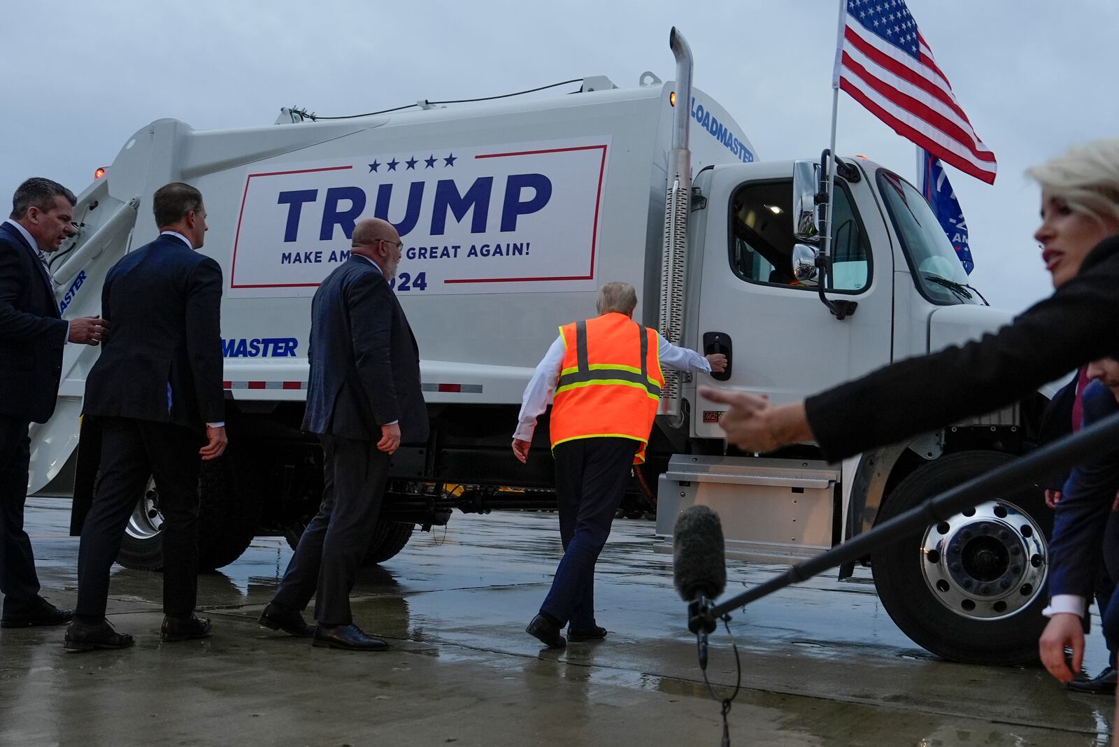 Republican presidential nominee former President Donald Trump climbs into a garbage truck Wednesday, Oct. 30, 2024, as he arrives in Green Bay, Wis. (AP Photo/Julia Demaree Nikhinson)