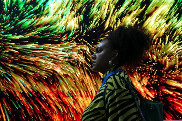 A person walks through the Turkey Pavilion during the COP29 U.N. Climate Summit, Friday, Nov. 15, 2024, in Baku, Azerbaijan. (AP Photo/Sergei Grits)