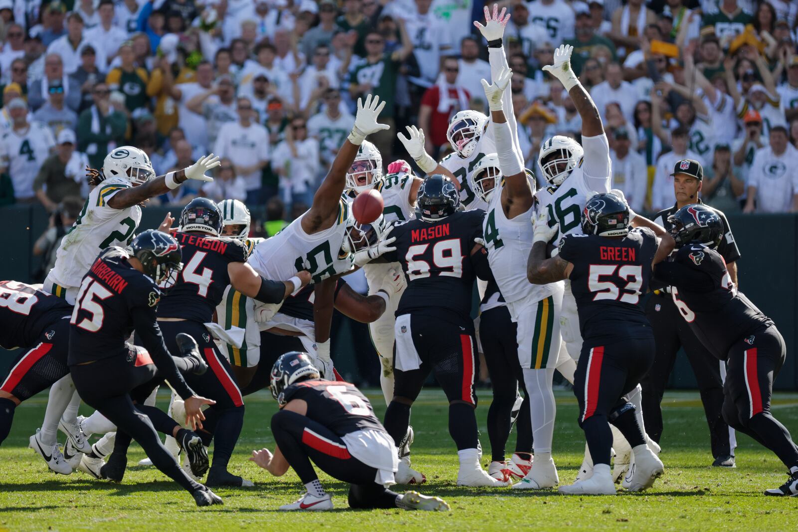 Houston Texans place kicker Ka'imi Fairbairn (15) kicks a 52-yard field goal during the first half of an NFL football game against the Green Bay Packers, Sunday, Oct. 20, 2024, in Green Bay, Wis. (AP Photo/Mike Roemer)