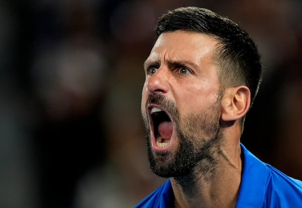 Novak Djokovic of Serbia reacts after winning a point against Tomas Machac of the Czech Republic during their third round match at the Australian Open tennis championship in Melbourne, Australia, Friday, Jan. 17, 2025. (AP Photo/Asanka Brendon Ratnayake)