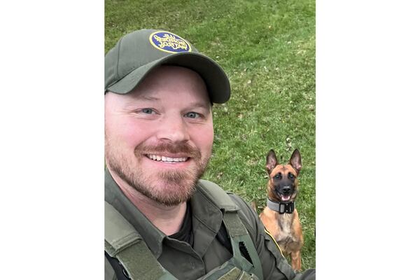 This undated image courtesy of Joan Mussa shows U.S. Border Patrol agent David Maland and his K9 partner, Cora. Maland was killed Monday, Jan. 20, 2025, following a traffic stop in Vermont. (David Maland/Joan Mussa via AP)