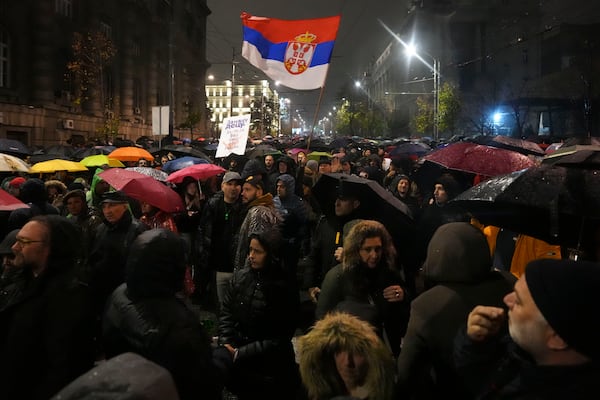 People march during a protest following collapse of a concrete canopy at the railway station in Novi Sad that killed 14 people, in Belgrade, Serbia, Monday, Nov. 11, 2024. (AP Photo/Darko Vojinovic)