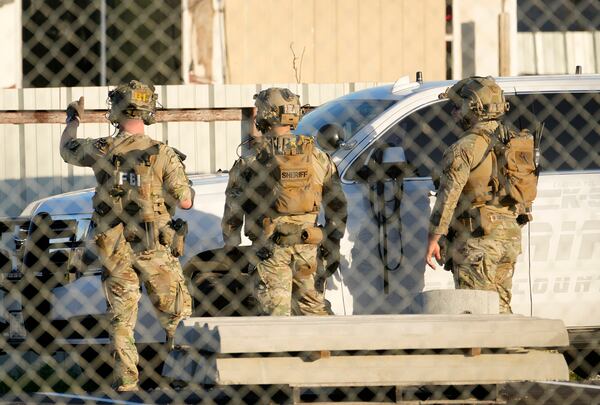 FILE - FBI and Harris County Sheriff's SWAT members work ,Wednesday, Jan. 1, 2025, near Crescent Peak Drive in Houston, where a police investigation continues into a property associated with Shamsud-Din Jabbar, who has been identified as the attacker in the New Orleans massacre. (Melissa Phillip/Houston Chronicle via AP, File)