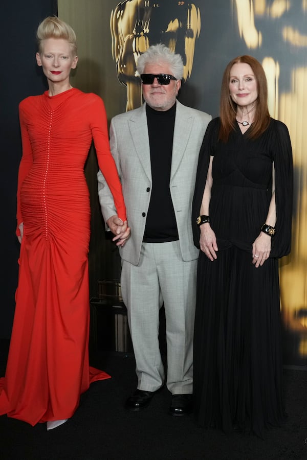 Tilda Swinton, from left, Pedro Almodovar and Julianne Moore arrive at the 15th Governors Awards on Sunday, Nov. 17, 2024, at The Ray Dolby Ballroom in Los Angeles. (Photo by Jordan Strauss/Invision/AP)