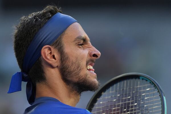 Lorenzo Musetti of Italy reacts during his third round match against Ben Shelton of the U.S. at the Australian Open tennis championship in Melbourne, Australia, Saturday, Jan. 18, 2025. (AP Photo/Ng Han Guan)