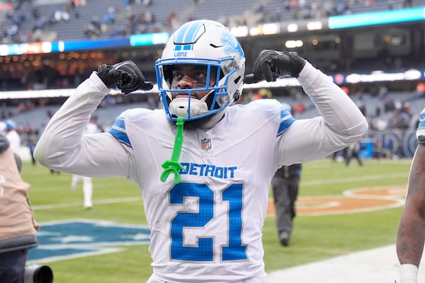 Detroit Lions cornerback Amik Robertson celebrates the team's 34-17 win over the Chicago Bears in an NFL football game Sunday, Dec. 22, 2024, in Chicago. (AP Photo/Erin Hooley)