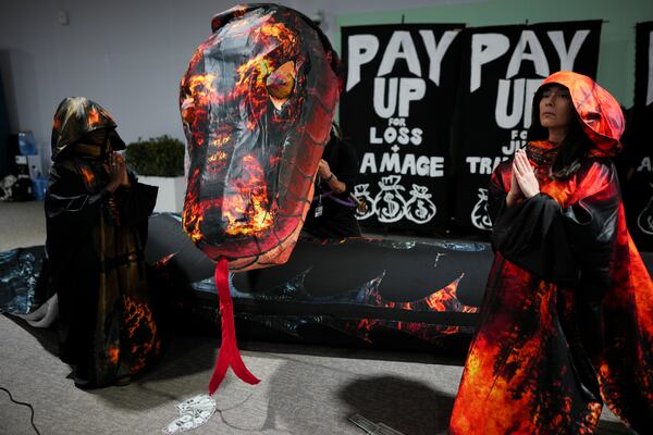 Activists participate in a demonstration for climate finance at the COP29 U.N. Climate Summit, Wednesday, Nov. 20, 2024, in Baku, Azerbaijan. (AP Photo/Peter Dejong)