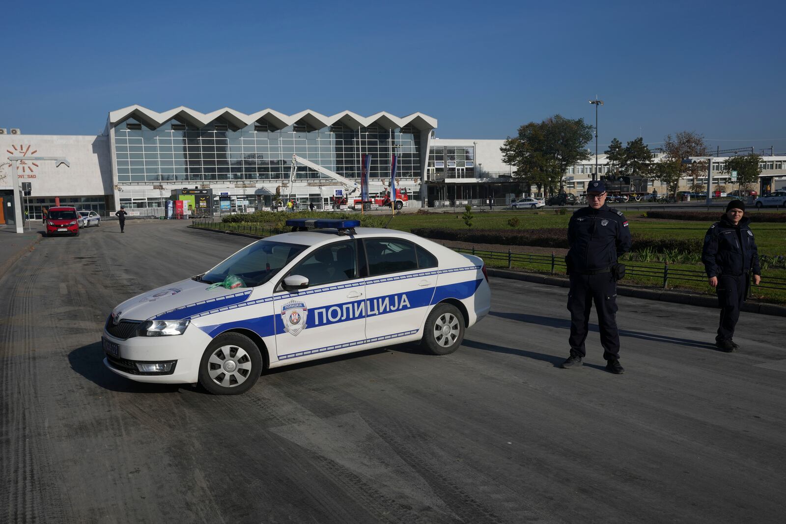 Police officers guard a train station after an outdoor roof collapsed on Friday, in Novi Sad, Serbia, Saturday, Nov. 2, 2024. (AP Photo/Darko Vojinovic)