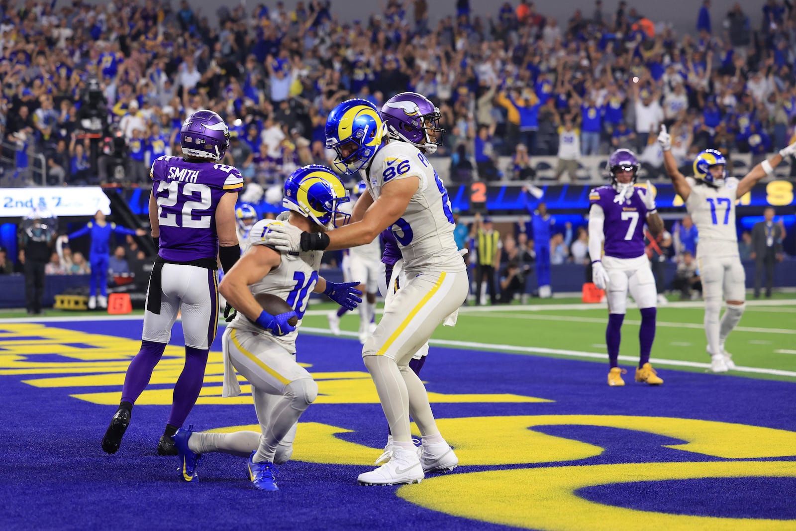 Los Angeles Rams wide receiver Cooper Kupp (10) celebrates with tight end Colby Parkinson (86) after catching a 7-yard touchdown pass during the first half of an NFL football game against the Minnesota Vikings, Thursday, Oct. 24, 2024, in Inglewood, Calif. (AP Photo/Ryan Sun)