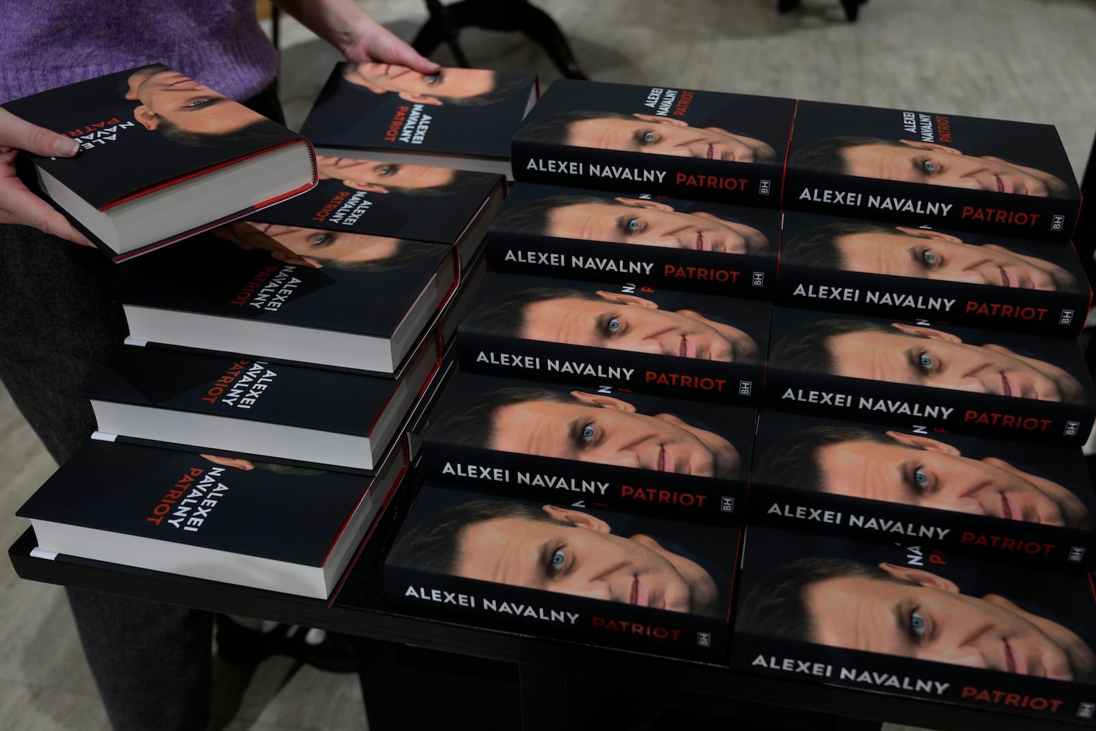 Copies of the late Russian opposition leader Alexei Navalny's memoir entitled 'Patriot' are put display on the first day of sale in a bookshop in London, Tuesday, Oct. 22, 2024. (AP Photo/Alastair Grant)