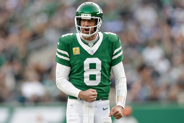 New York Jets quarterback Aaron Rodgers (8) reacts during the fourth quarter of an NFL football game against the Indianapolis Colts, Sunday, Nov. 17, 2024, in East Rutherford, N.J. (AP Photo/Adam Hunger)