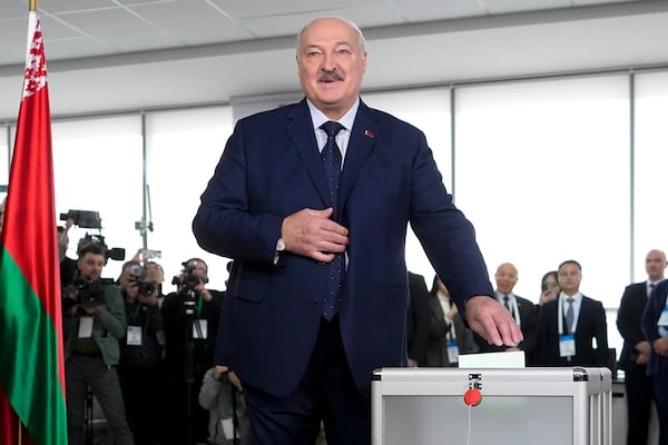 Belarusian President Alexander Lukashenko casts his ballot at a polling site during voting in presidential elections in Minsk, Belarus, Sunday, Jan. 26, 2025. (AP Photo/Pavel Bednyakov)