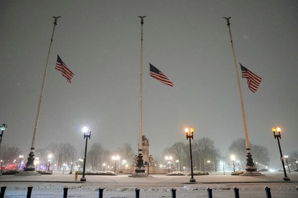 Flags fly at half-staff in memorial to former President Jimmy Carter during a winter snow storm at Union Station in Washington, Monday, Jan. 6, 2025. Carter died at age 100. (AP Photo/Matt Rourke)