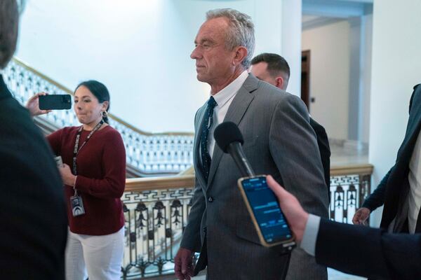 Robert F. Kennedy Jr., President-elect Donald Trump's nominee to be Secretary of Health and Human Services, walks to meet with Sen. Roger Marshall, R-Kan., at the Capitol in Washington, Tuesday, Dec. 17, 2024. (AP Photo/Jose Luis Magana)