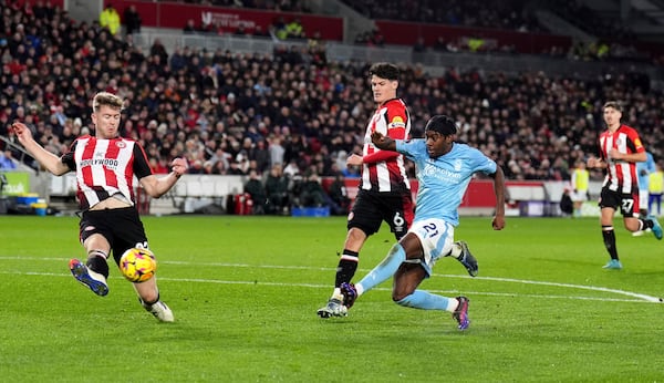 Nottingham Forest's Anthony Elanga, centre right, shoots on target during during the English Premier League soccer match between Brentford and Nottingham Forest at the Gtech Community Stadium, London, Saturday Dec. 21, 2024. (John Walton/PA via AP)