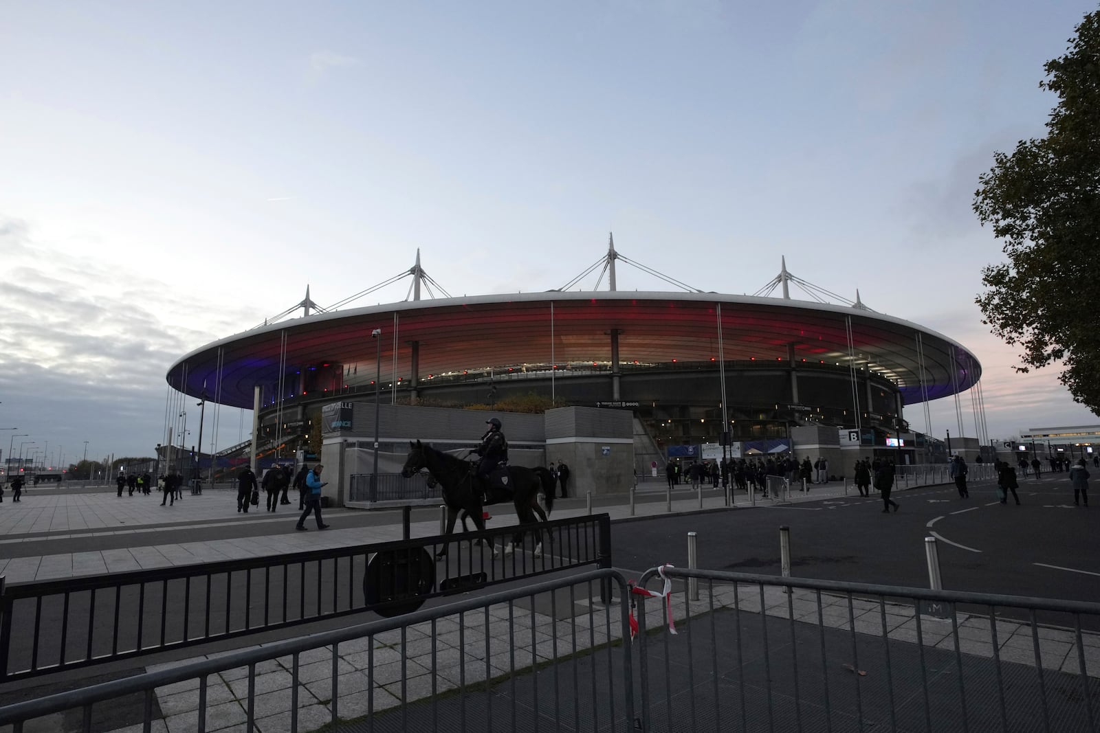 A mounted police officer patrols past the stadium ahead of the Nations League soccer match France against Israel outside the Stade de France stadium, Thursday, Nov. 14, 2024 in Saint-Denis, outside Paris. (AP Photo/Aurelien Morissard)