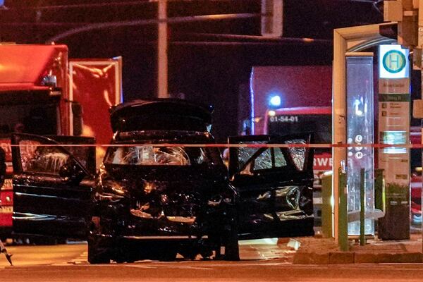 The car that was crashed into a crowd of people at the Magdeburg Christmas market is seen following the attack in Magdeburg, Germany, Saturday early morning, Dec. 21, 2024. (AP Photo/Ebrahim Noroozi)