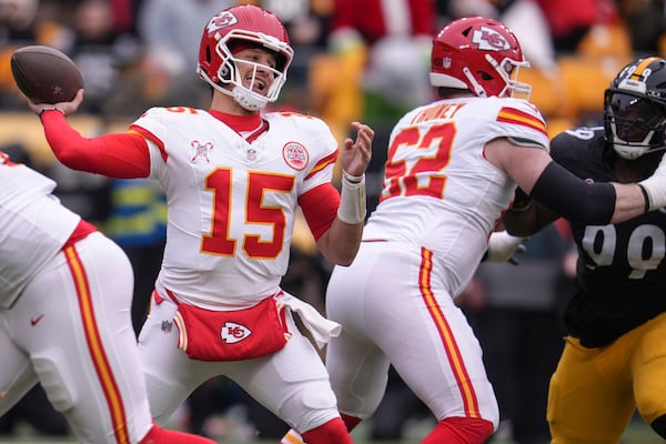 Kansas City Chiefs quarterback Patrick Mahomes (15) passes against the Pittsburgh Steelers during the first half of an NFL football game, Wednesday, Dec. 25, 2024, in Pittsburgh. (AP Photo/Gene J. Puskar)