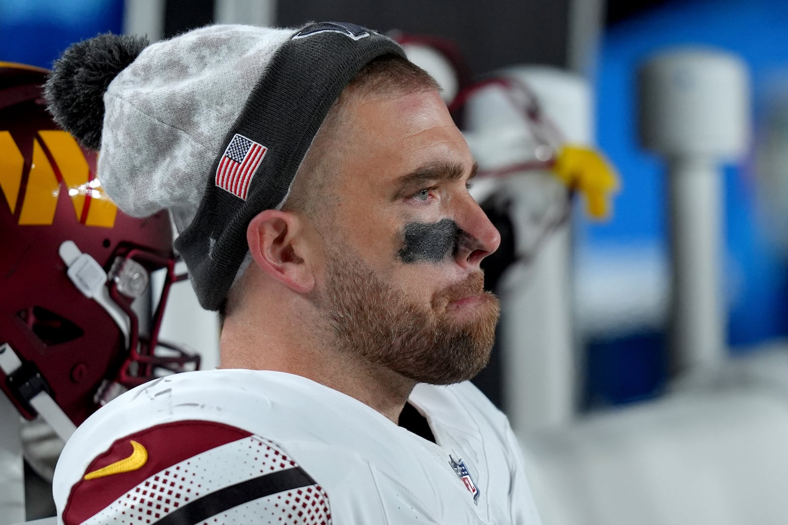 Washington Commanders tight end Zach Ertz sits on the bench during the second half of an NFL football game against the Philadelphia Eagles Thursday, Nov. 14, 2024, in Philadelphia. (AP Photo/Chris Szagola)