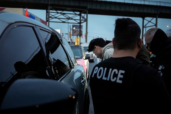 Deportation officers with Enforcement and Removal Operations in U.S. Immigration and Customs Enforcement's New York City field office arrest Wilmer Patricio Medina-Medina during an early morning operation, Tuesday, Dec. 17, 2024, in the Bronx borough of New York. (AP Photo/Julia Demaree Nikhinson)