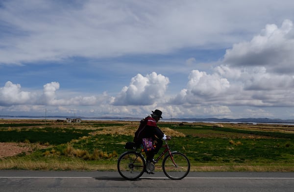 An Aymara man rides as he head to a polling station during judicial elections in Jesus de Machaca, Bolivia, Sunday, Dec. 15, 2024. (AP Photo/Juan Karita)