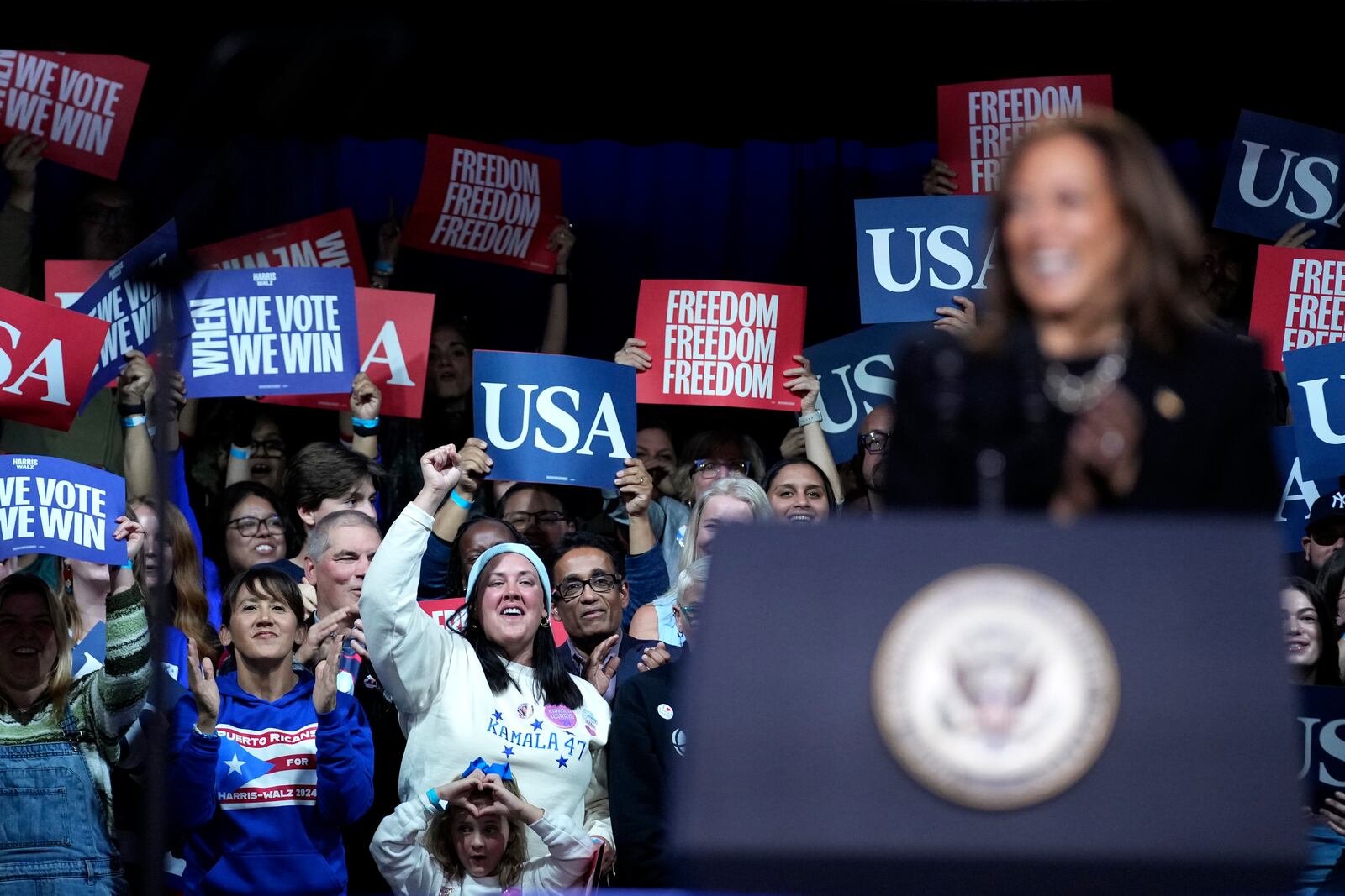 Supporters cheer as Democratic presidential nominee Vice President Kamala Harris speaks during a campaign rally in Memorial Hall at Muhlenberg College in Allentown, Pa., Monday, Nov. 4, 2024. (AP Photo/Susan Walsh)