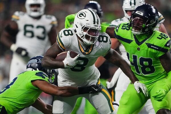 Green Bay Packers' Josh Jacobs runs during the first half of an NFL football game against the Seattle Seahawks Sunday, Dec. 15, 2024, in Seattle. (AP Photo/Lindsey Wasson)