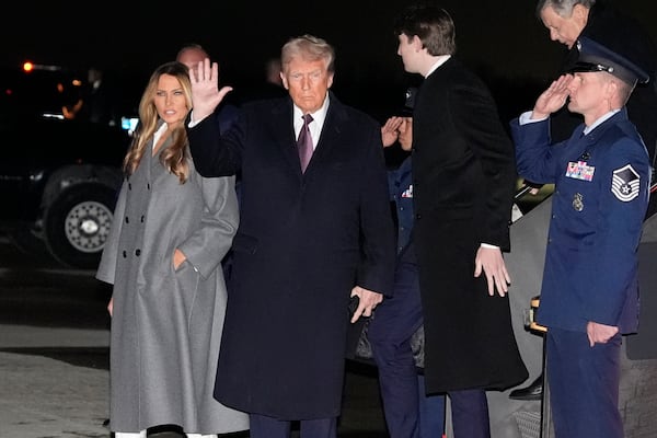 President-elect Donald Trump and Melania Trump, walk off an Air Force Special Mission airplane as they arrive at Dulles International Airport, Saturday, Jan. 18, 2025, in Dulles, Va. (AP Photo/Alex Brandon)