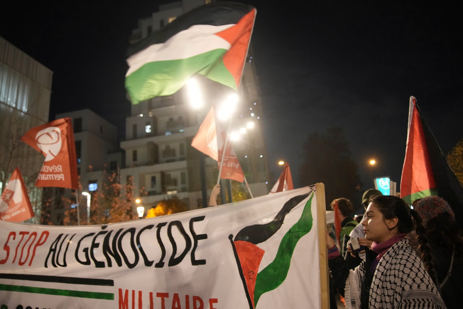 Demonstrators attend a rally in support of the Palestinian people, ahead of the Nations League soccer match France against Israel, Thursday, Nov. 14, 2024 in Saint-Denis, outside Paris. (AP Photo/Christophe Ena)