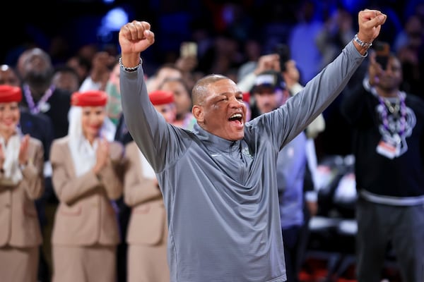 Milwaukee Bucks head coach Doc Rivers cheers after his team's victory in the championship game of the NBA Cup basketball tournament against the Oklahoma City Thunder Tuesday, Dec. 17, 2024, in Las Vegas. (AP Photo/Ian Maule)