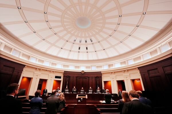 Justices of the Michigan Supreme Court enter their court at the Michigan Hall of Justice, Wednesday, Dec. 4, 2024, in Lansing, Mich. (AP Photo/Carlos Osorio)