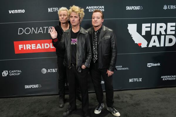 Mike Dirnt, from left, Billie Joe Armstrong, and Tre Cool of Green Day arrive at the FireAid benefit concert on Thursday, Jan. 30, 2025, at Intuit Dome in Inglewood, Calif. (Photo by Jordan Strauss/Invision/AP)