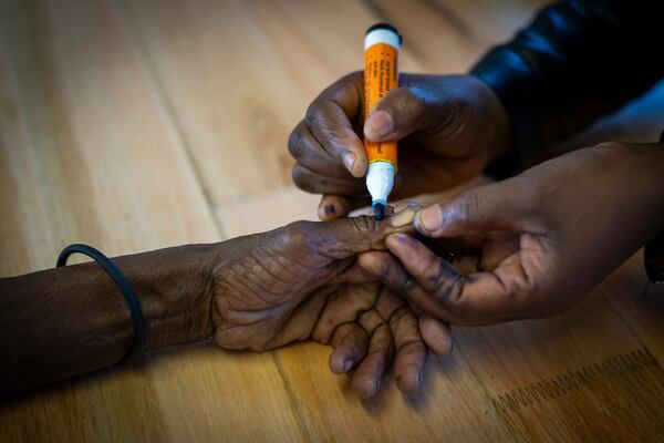 A woman is marked on her hand after casting her ballot on Wednesday May 29, 2024 during general elections in Nkandla, Kwazulu Natal, South Africa. South Africans are voting in an election seen as their country's most important in 30 years, and one that could put them in unknown territory in the short history of their democracy, the three-decade dominance of the African National Congress party being the target of a new generation of discontent in a country of 62 million people — half of whom are estimated to be living in poverty. (AP Photo/Emilio Morenatti)