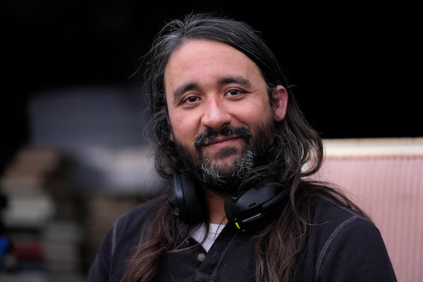 Steve Alejandro poses for a photo outside his home Wednesday, Dec. 18, 2024, in Wentzville, Mo. (AP Photo/Jeff Roberson)