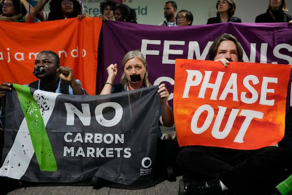 Activists participate in a demonstration at the COP29 U.N. Climate Summit, Saturday, Nov. 16, 2024, in Baku, Azerbaijan. (AP Photo/Rafiq Maqbool)