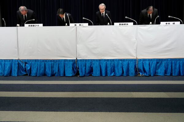 Ryunosuke Endo, from left, vice chairman of the Board of Fuji Television Network, Koichi Minato, president and CEO of Fuji Television Network, Shuji Kano, Fuji Media Holdings COB, Osamu Kanemitsu, president and CEO of Fuji Media Holdings, bow during a news conference at the Fuji Television headquarters in Tokyo, Monday, Jan. 27, 2025. (AP Photo/Eugene Hoshiko)