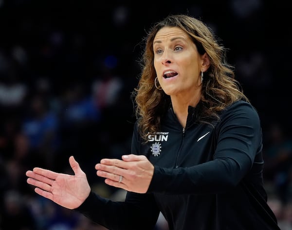 FILE - Connecticut Sun head coach Stephanie White shouts instructions to her players during the first half of a WNBA basketball game against the Phoenix Mercury, July 1, 2024, in Phoenix. (AP Photo/Ross D. Franklin, File)