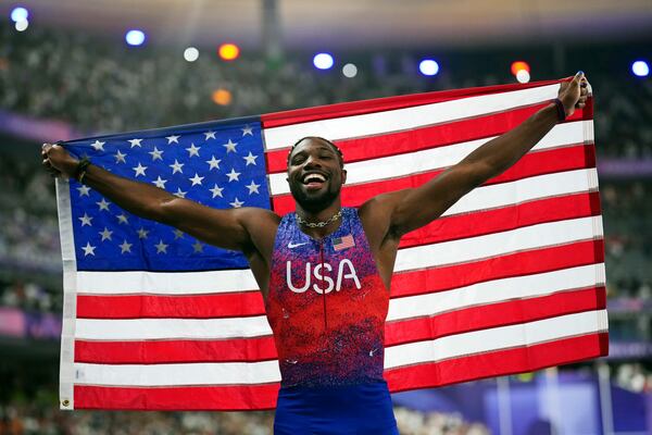 FILE - Noah Lyles, of the United States, celebrates after winning the men's 100-meter final at the 2024 Summer Olympics, Sunday, Aug. 4, 2024, in Saint-Denis, France. (AP Photo/Petr David Josek, File)